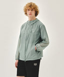 HOODED PACKABLE NYLON JACKET IN MINT GREY image 2