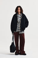 HIGH NECK BUTTON POINT ZIP UP JUMPER IN BLACK image 19