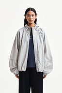 BACK LOGO HOODY WIND BREAKER IN LIGHT BEIGE image 18