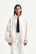 BACK LOGO HIGH NECK JUMPER IN CREAM image 7