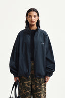 BACK LOGO HIGH NECK JUMPER IN CHARCOAL GREY
