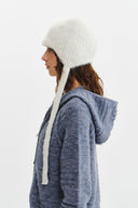 TASSEL TIE KNIT BEANIE IN IVORY