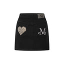 CORON BACK LEATHER LEOPARD HEART PATCH SKIRTS IN BLACK