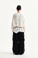 ASYMMETRIC DAMAGED KNIT PULLOVER IN IVORY image 17