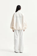 BACK LOGO HIGH NECK JUMPER IN CREAM image 9